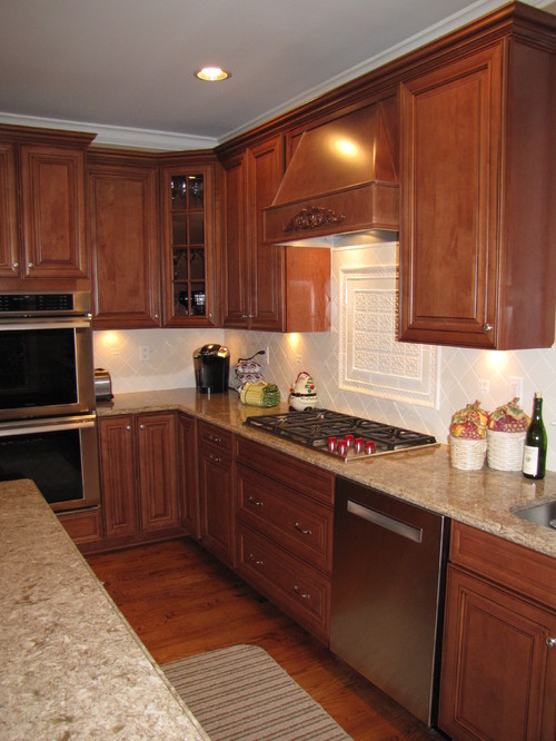 Cambria Berkeley Engineered Stone Countertop and Cambria Berkeley Engineered Stone Island Top with Aburn Glazed Maple Cabinets, Stainless Steel Appliance and White Hand Made Backsplash Tiles